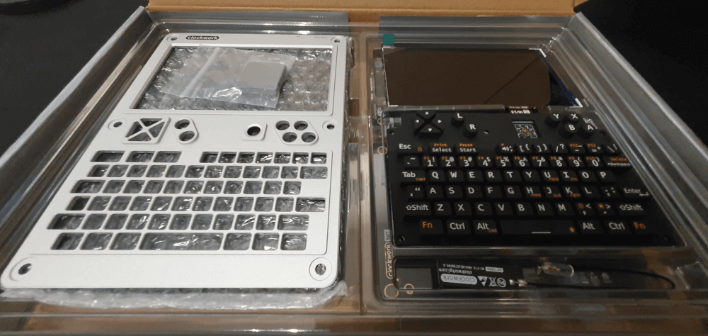 A uConsole in the package, showing the face place, the keyboard and screen on top.